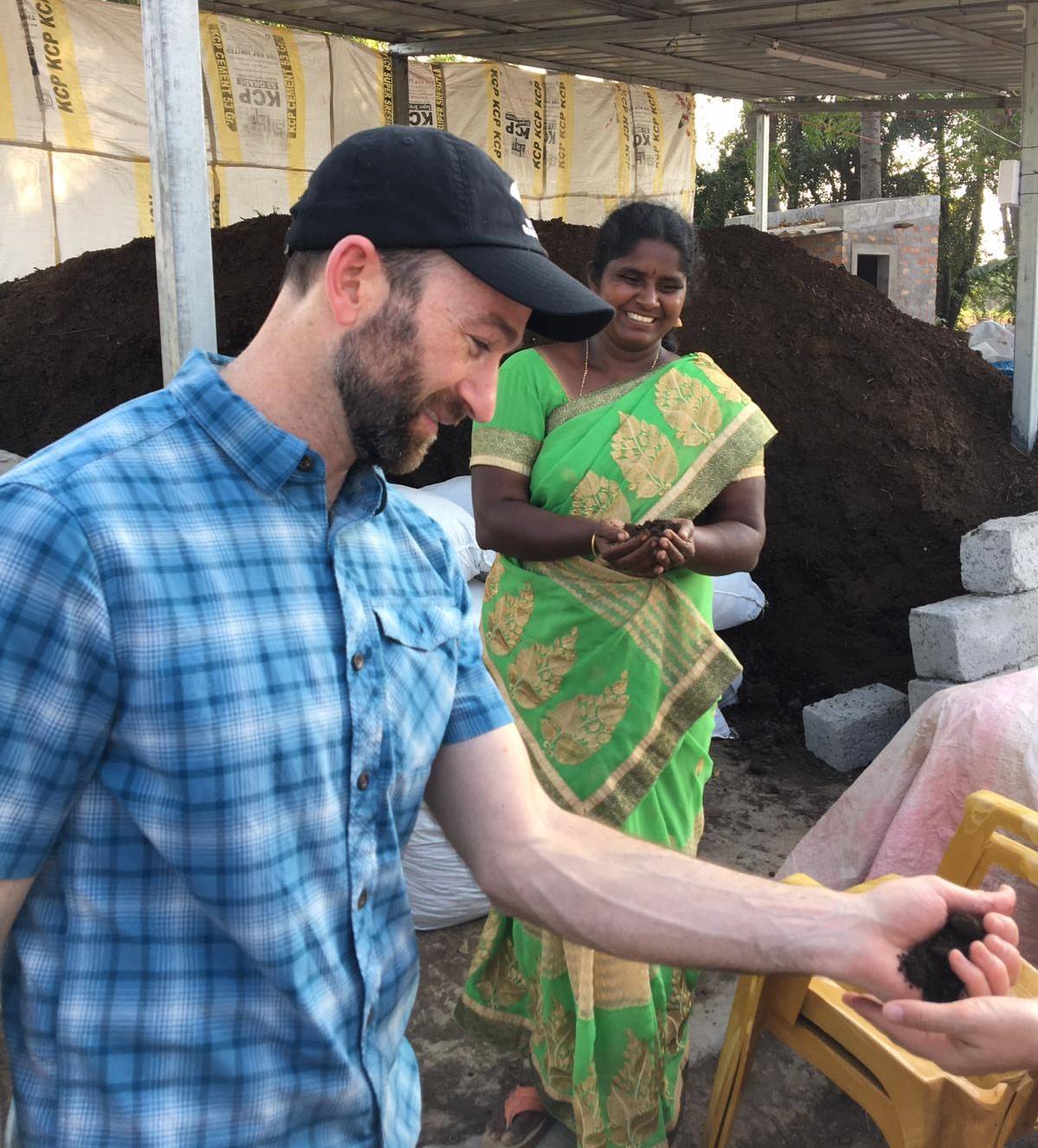 Dr. Jon Sanderman holding handful of soil