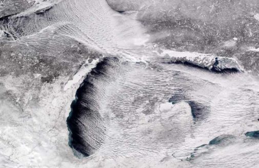 satellite photo of the partially frozen Great Lakes.