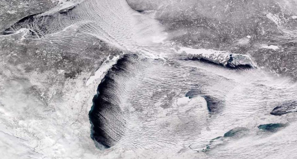 satellite photo of the partially frozen Great Lakes.