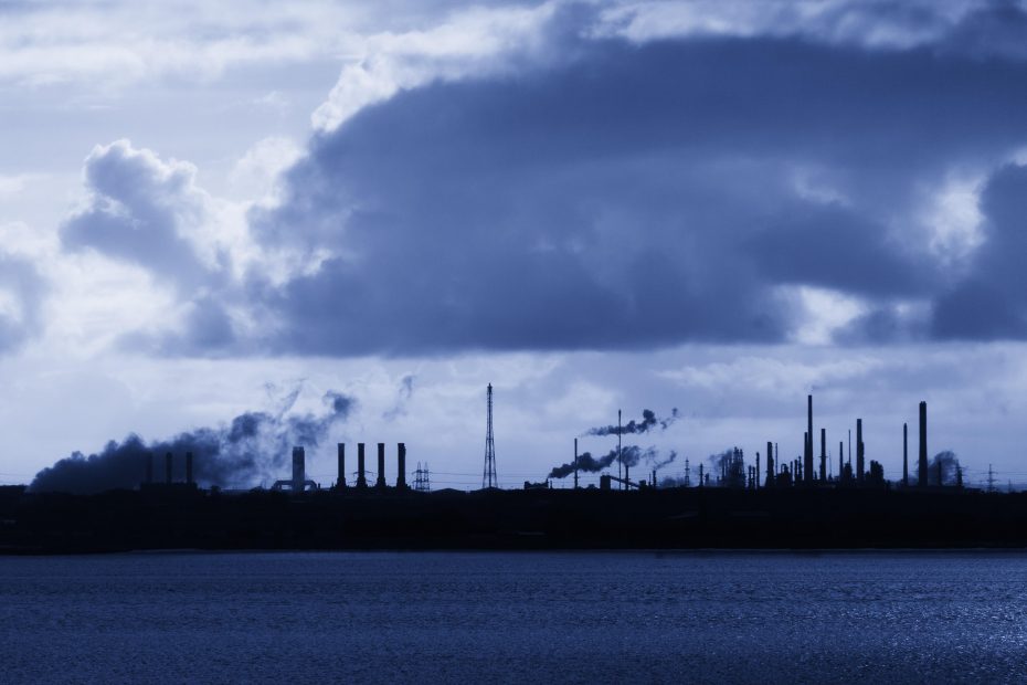 Silhouetted industrial area with smokestacks