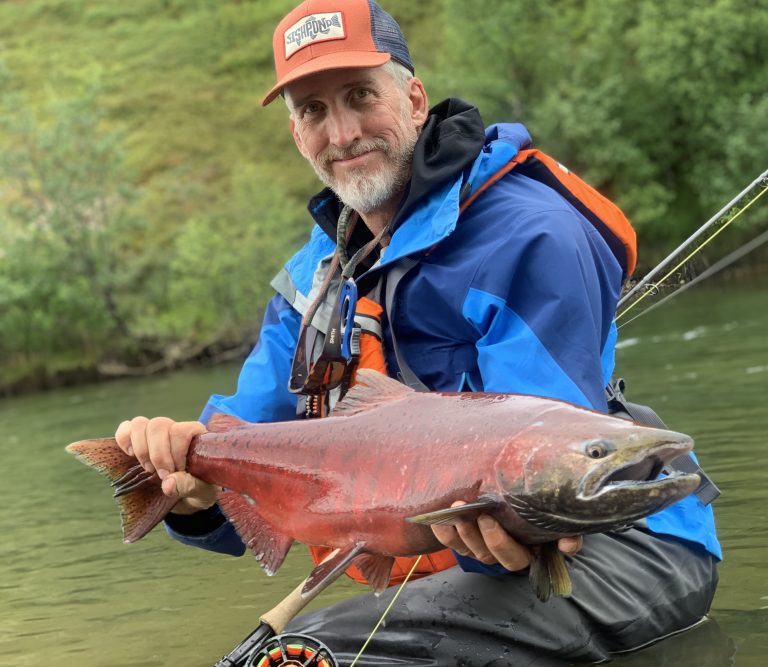 Dr. Max Holmes holding a fish