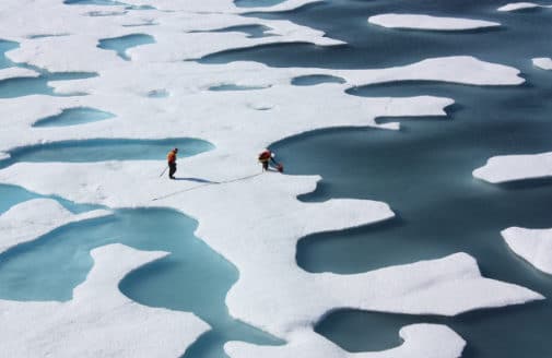 Scientists retrieve a canister of supplies airdropped in the Arctic. Photo by Kathryn Hansen, NASA Goddard Space Flight Center