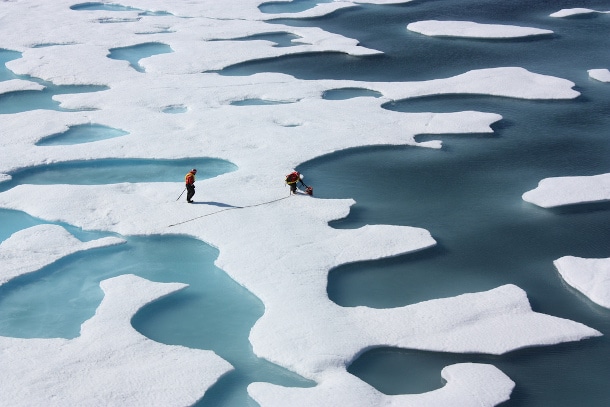 Scientists retrieve a canister of supplies airdropped in the Arctic. Photo by Kathryn Hansen, NASA Goddard Space Flight Center