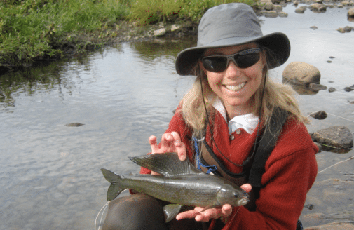 Dr. Heidi Golding holding a grayling.