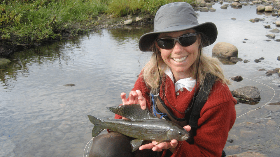 Dr. Heidi Golding holding a grayling.