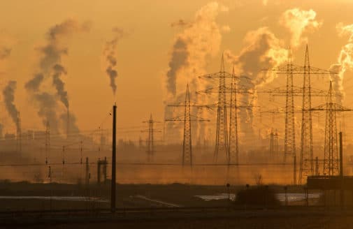 skyline with smokestacks and smog