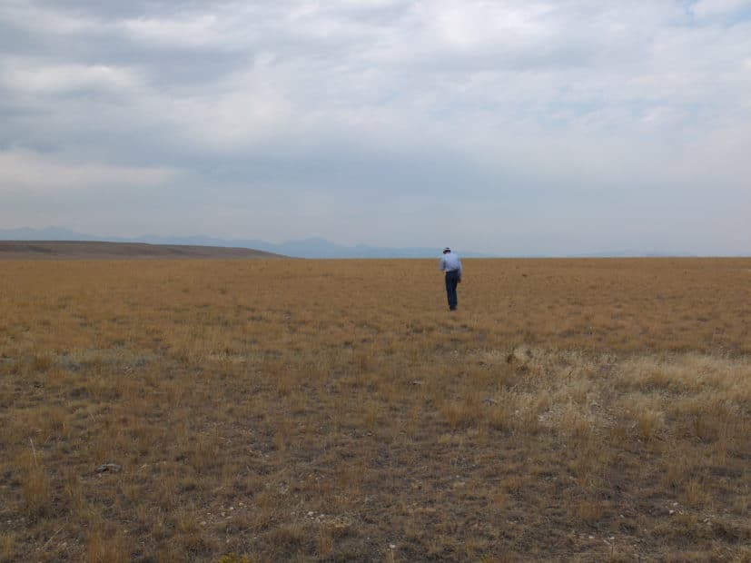 man standing on ranch near Bozeman Montana, photo by Jonathan Sanderman