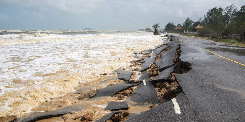 Coastal road damage sustained from a storm.