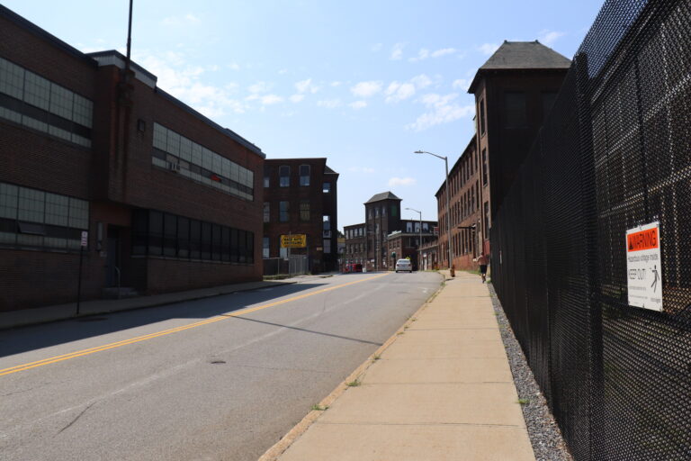 sunny paved street in industrial neighborhood in worcester MA