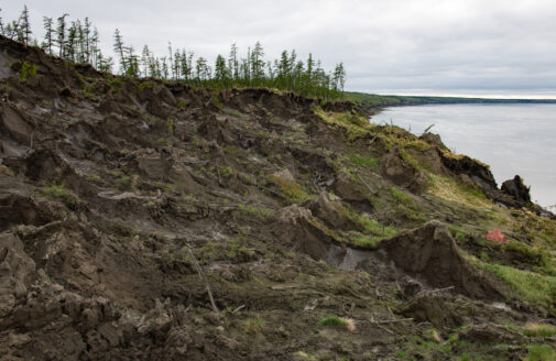 collapsing slope near water in siberia due to permafrost thaw