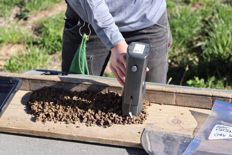 colleen smith uses spectral scanner on soil core