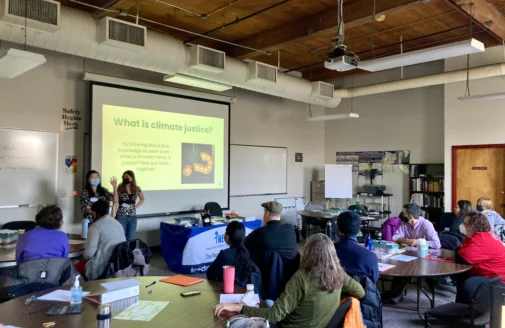 spring forward students presenting a powerpoint to a room of teachers