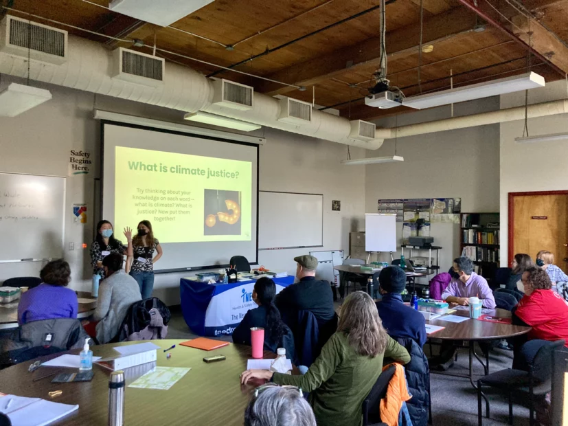 spring forward students presenting a powerpoint to a room of teachers