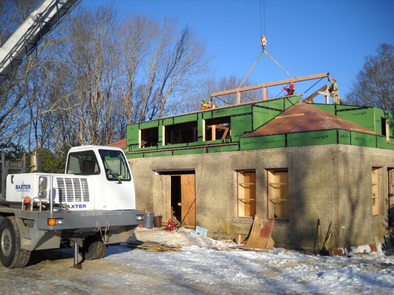 A truck sits outside the Carriage House, undergoing renovations.