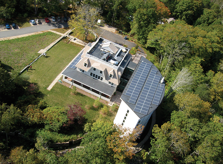 An aerial view of the Gilman Ordway campus, showing the solar panels on the building's roof.