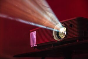 Beams of light shine out of a projector