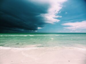 Storm clouds roll over a blue Florida ocean view