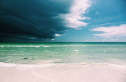 Storm clouds roll over a blue Florida ocean view