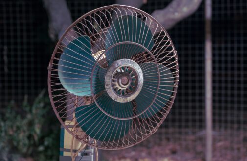 A rotating fan with blue blades