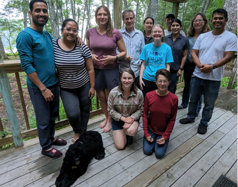 a group photo showing the people (and dog) working at Howland forest on this project