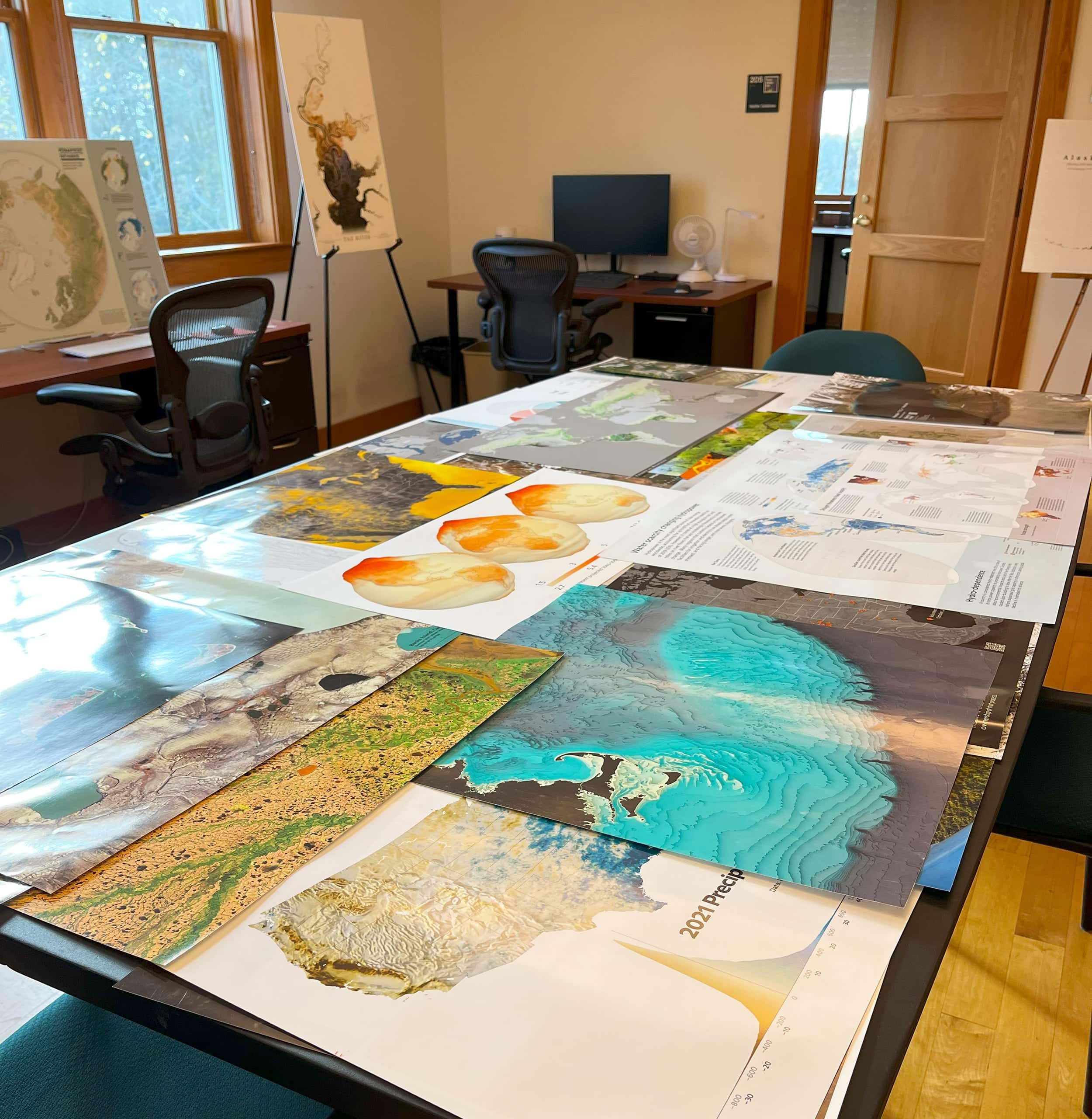 table covered in maps at the center's office