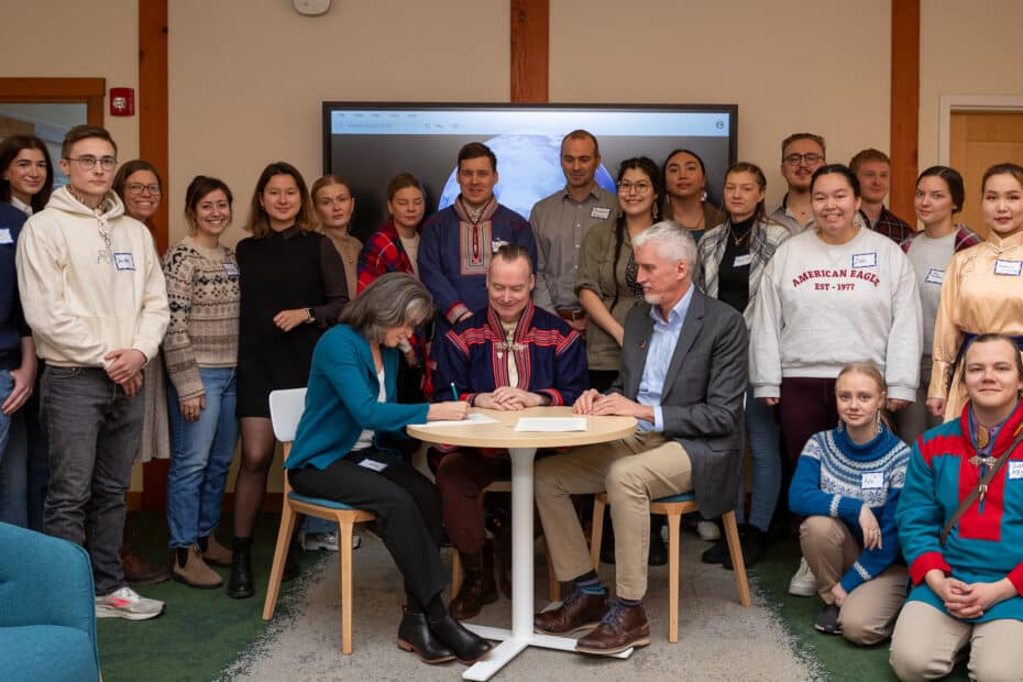 Arctic Indigenous youth leaders gather with Arctic Initiative, Woodwell Climate, and ICR staff as the MOU is signed.