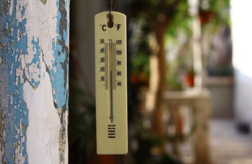 a thermometer hangs outside