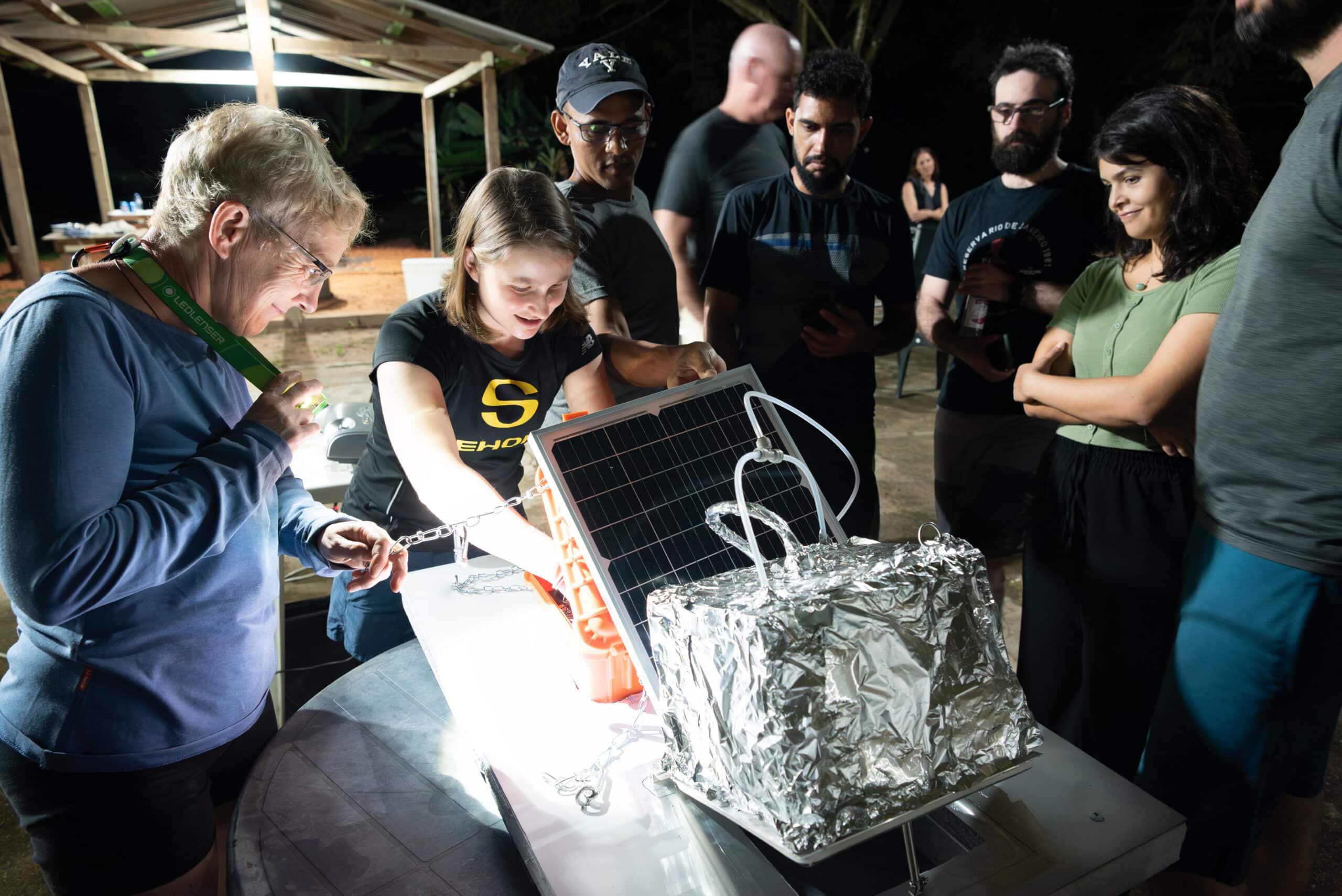 dietrich presents methane chamber to group of people gathered around