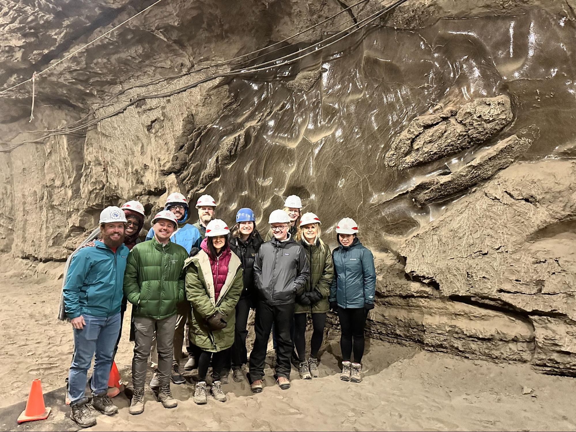 Members of the Permafrost Discovery Gateway team touring a permafrost tunnel in Alaska.