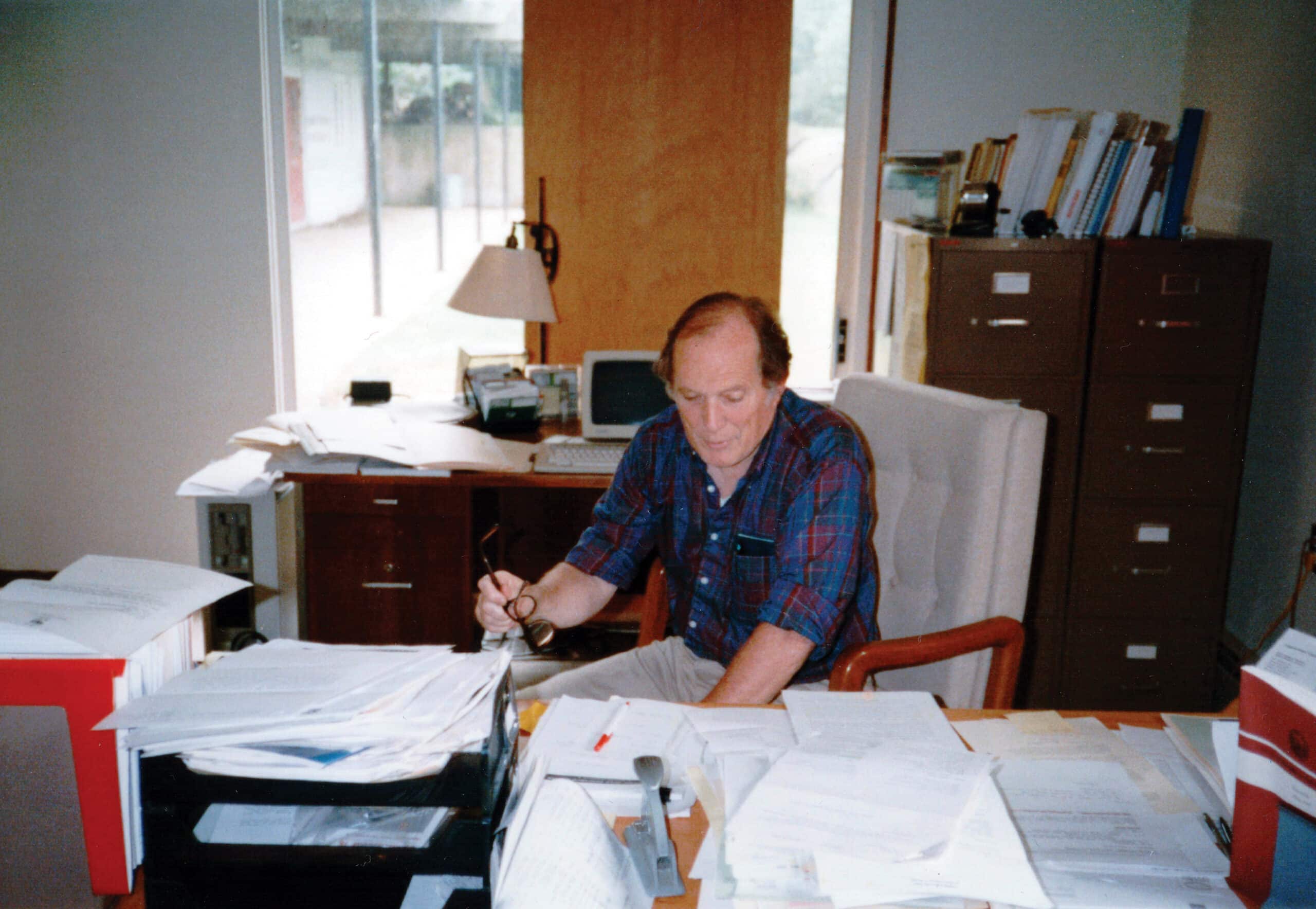 George Woodwell sits at a desk