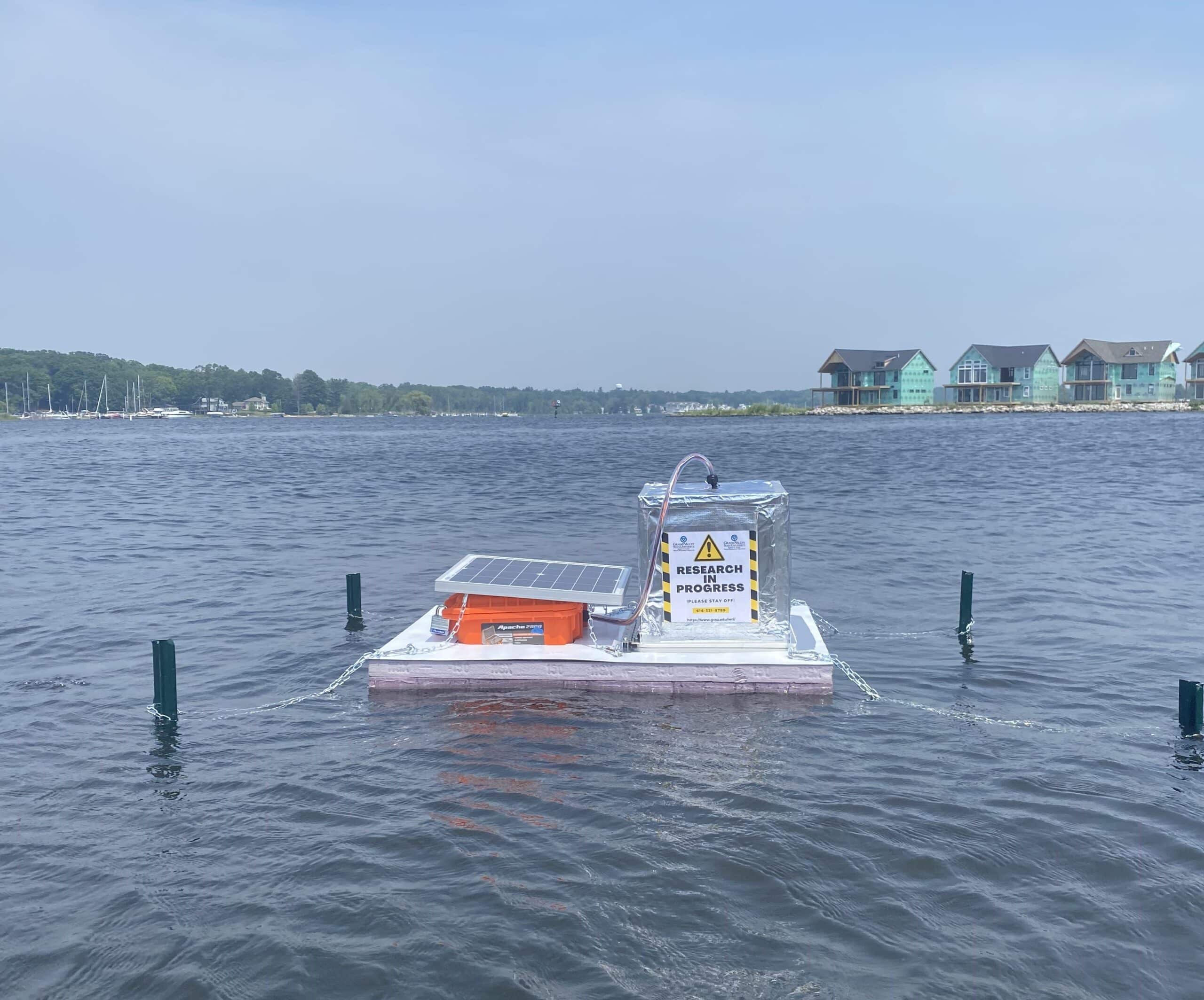 Jillian's floating chamber moored to several stakes in a lake in michigan