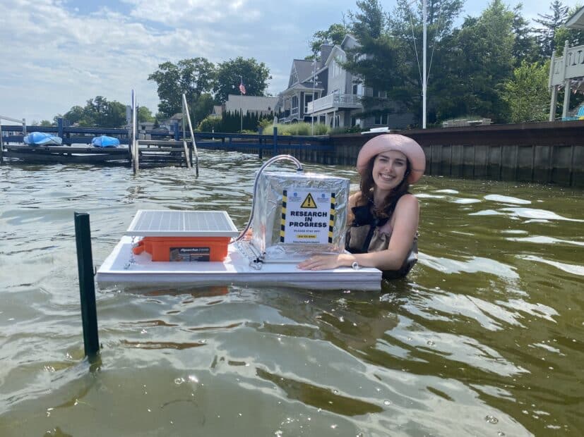 jillian greene stands in the water with her chamber based on zoe dietrich's designs