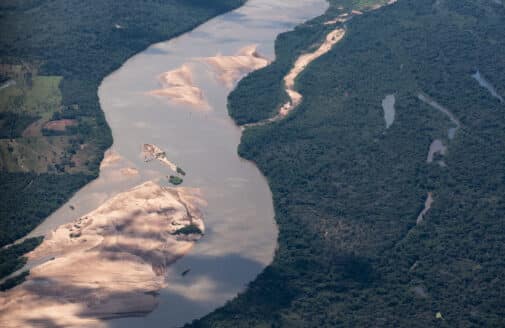 aerial view of a riverbed with a dry island in the center