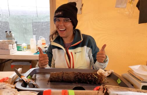 Esmeralda Torres Martínez poses in front of a permafrost core