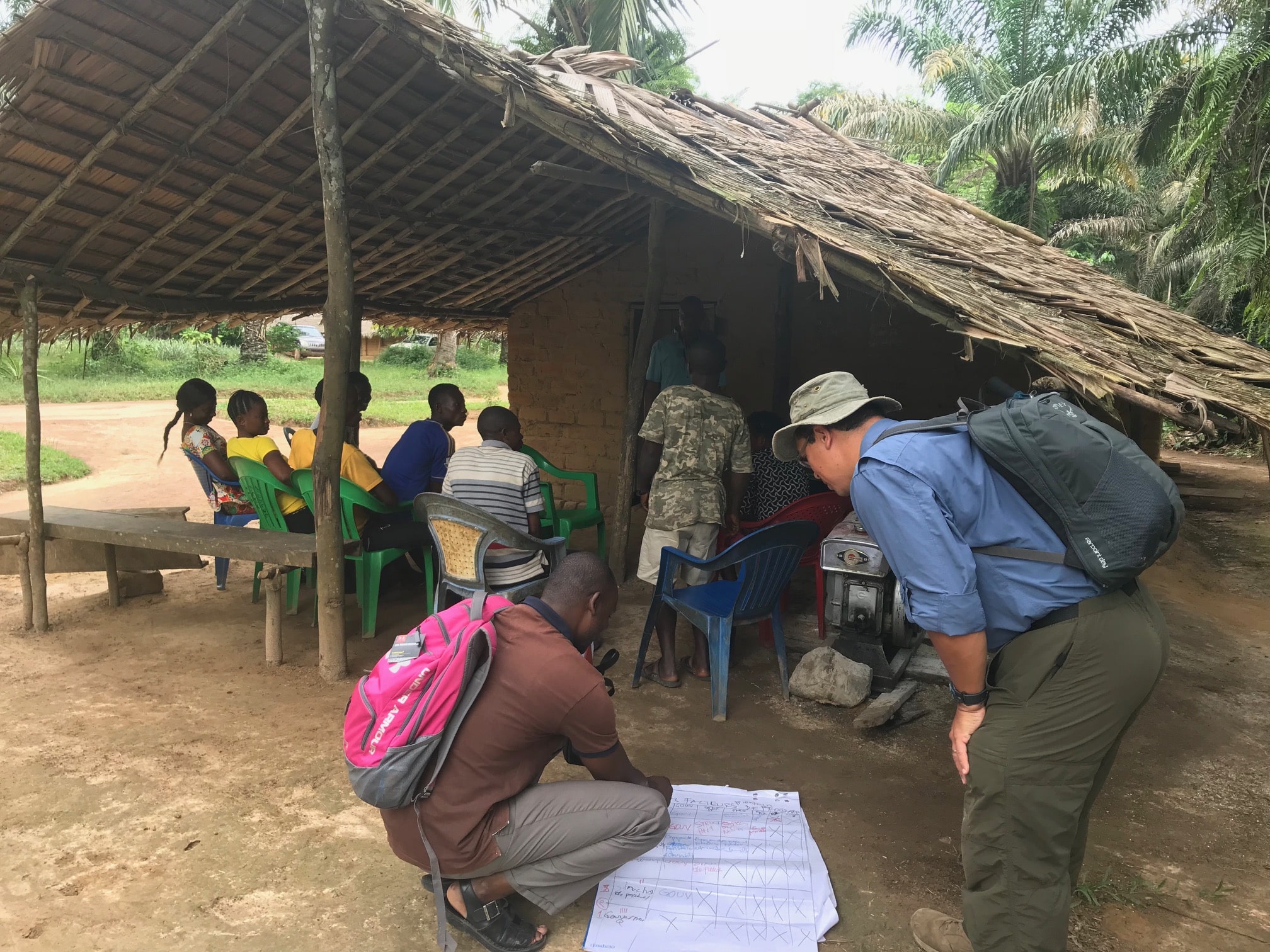 Glen bush and Joseph zambo conduct community surveys